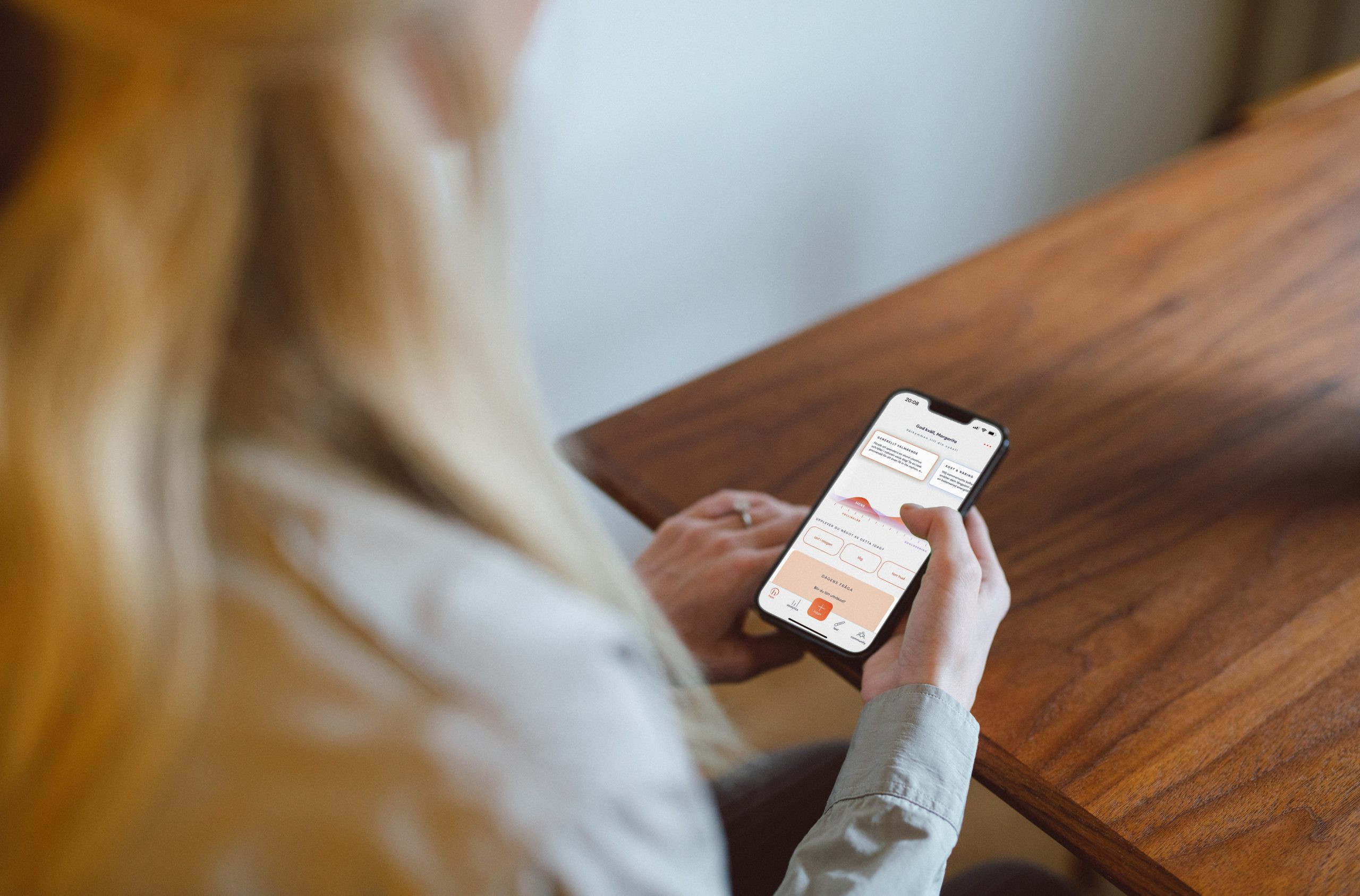 woman holding phone