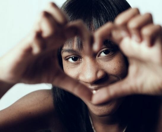 woman making a heart sign