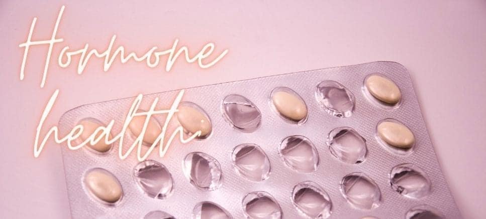 contraception pills on pink bakground