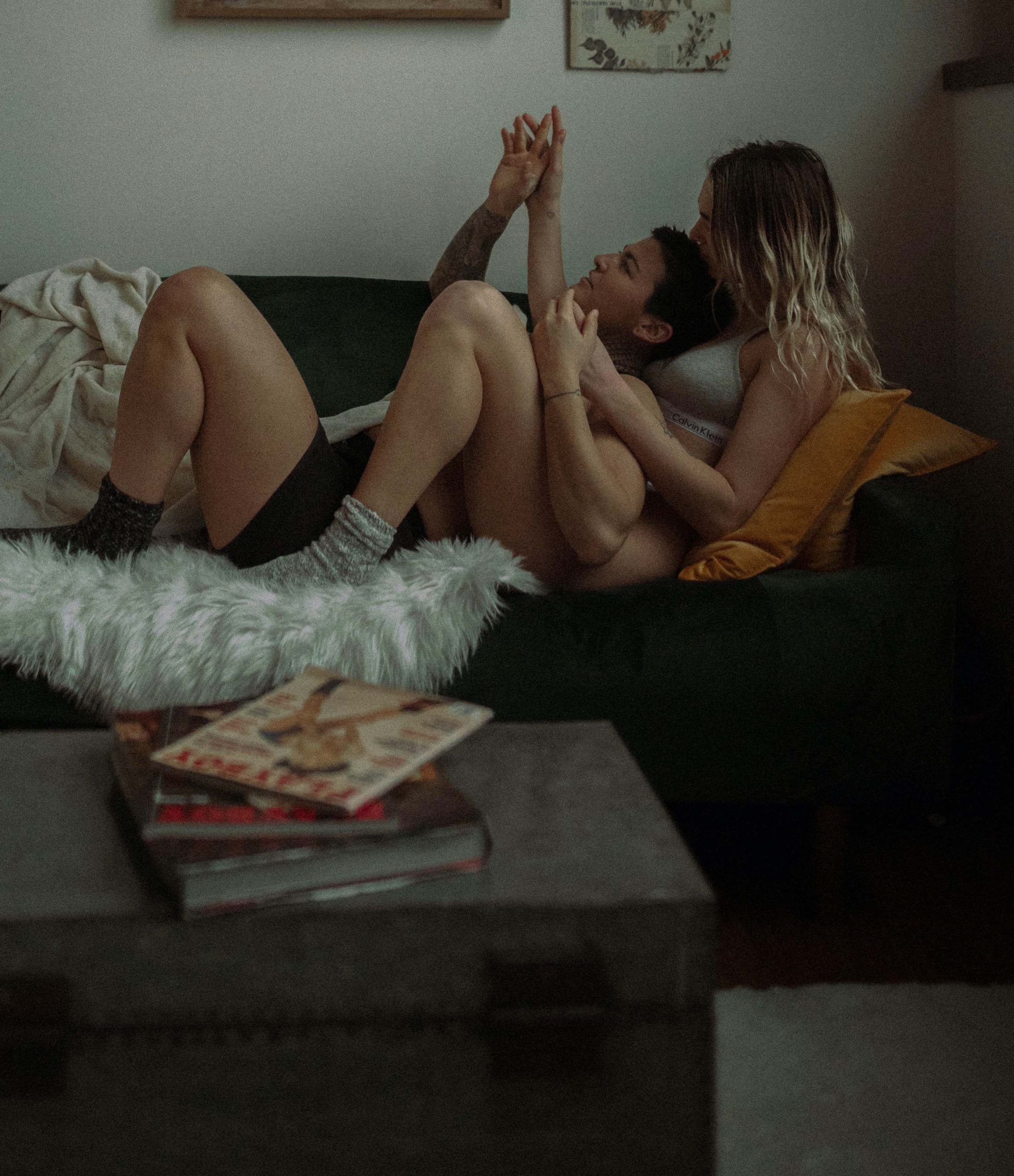 women laid on the sofa