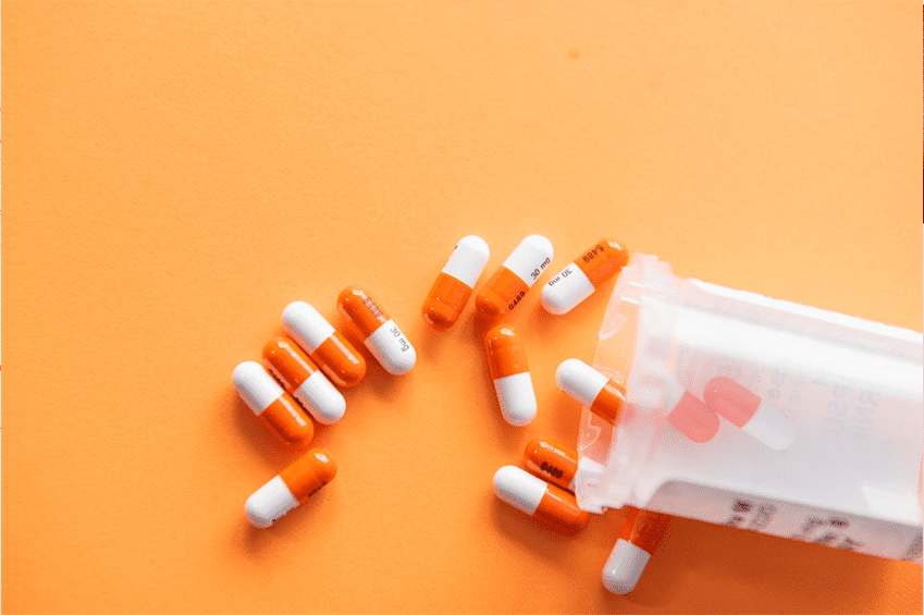 pills spilling out of pill bottle